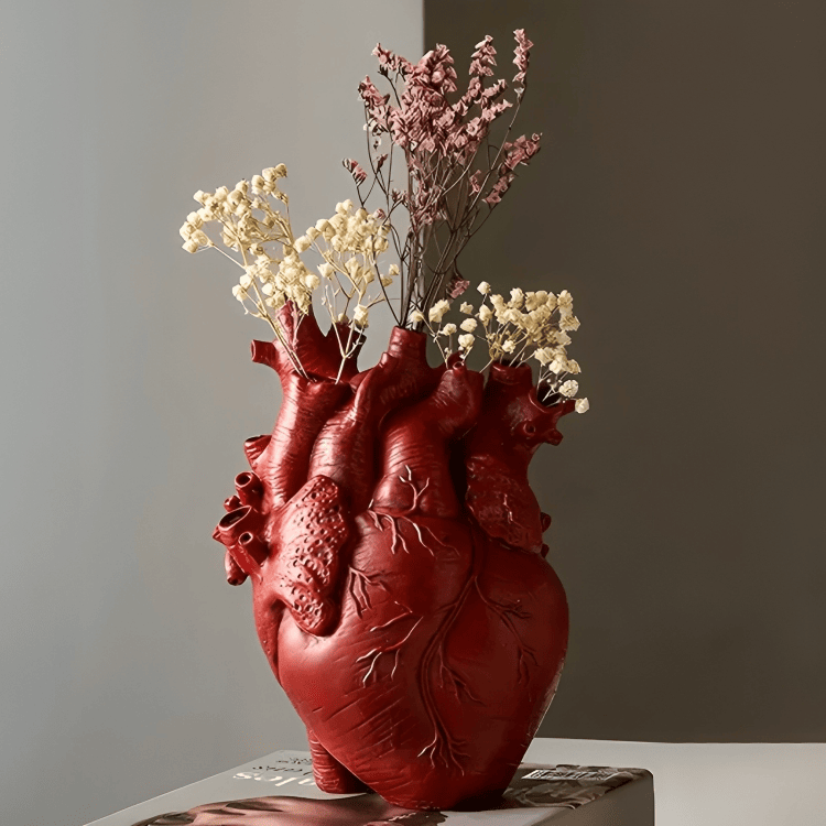 PLTNRTZ® Amor Heart Vase in red, beautifully arranged with fresh flowers, demonstrating its functionality and artistic charm.